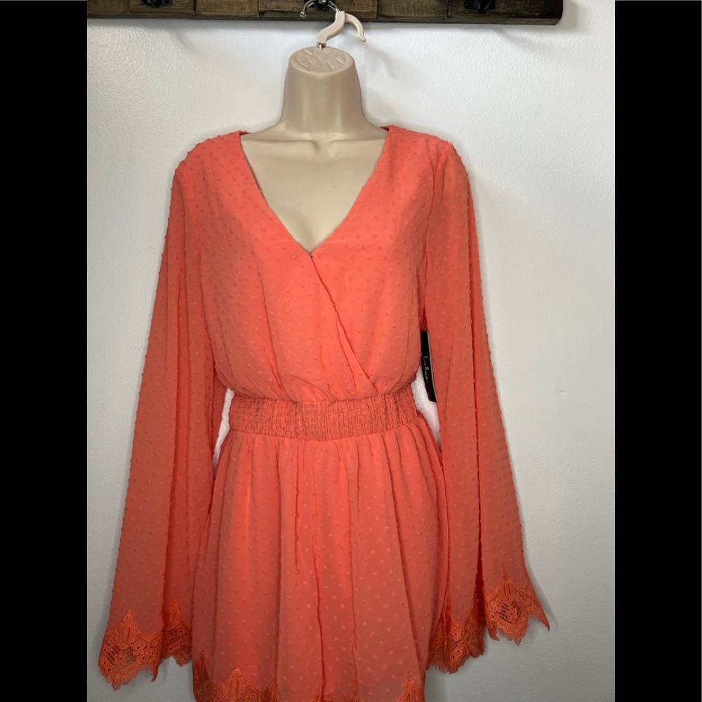Lulu’s Coral Swiss Dot and lace Romper